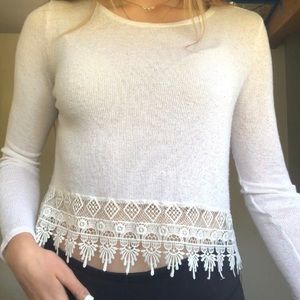 White long sleeve shirt with pattern on bottom
